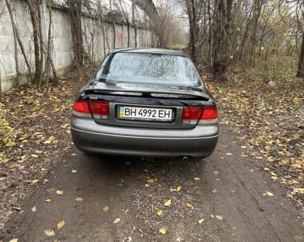 Черный Мазда 626, объемом двигателя 2 л и пробегом 300 тыс. км за 1150 $, фото 1 на Automoto.ua