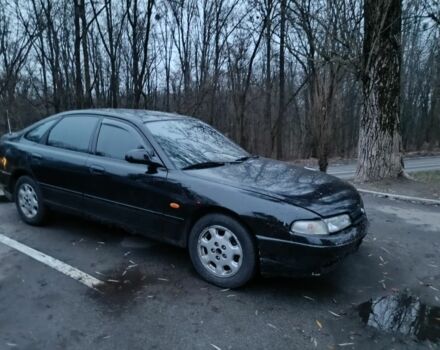 Черный Мазда 626, объемом двигателя 2.5 л и пробегом 480 тыс. км за 1400 $, фото 1 на Automoto.ua