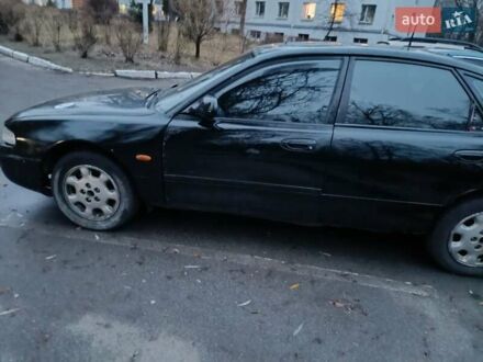 Черный Мазда 626, объемом двигателя 2.5 л и пробегом 480 тыс. км за 1400 $, фото 1 на Automoto.ua