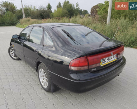 Черный Мазда 626, объемом двигателя 1.84 л и пробегом 430 тыс. км за 1900 $, фото 1 на Automoto.ua