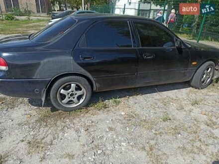 Чорний Мазда 626, об'ємом двигуна 1.99 л та пробігом 301 тис. км за 1500 $, фото 1 на Automoto.ua