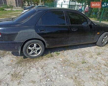 Черный Мазда 626, объемом двигателя 1.99 л и пробегом 301 тыс. км за 1500 $, фото 1 на Automoto.ua