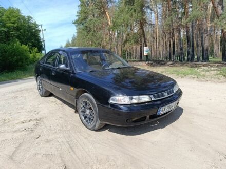 Мазда 626 1993 у Изюме на Automoto.ua Чорний Мазда 626, об'ємом двигуна 2.2 л та пробігом 333 тис. км за 1750 $, фото 1 на Automoto.ua