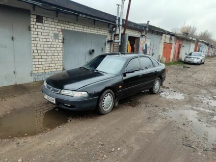 Черный Мазда 626, объемом двигателя 2 л и пробегом 573 тыс. км за 1100 $, фото 1 на Automoto.ua