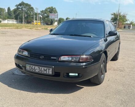 Черный Мазда 626, объемом двигателя 1.8 л и пробегом 310 тыс. км за 3000 $, фото 1 на Automoto.ua