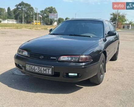 Черный Мазда 626, объемом двигателя 1.8 л и пробегом 310 тыс. км за 3300 $, фото 1 на Automoto.ua