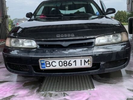Черный Мазда 626, объемом двигателя 2 л и пробегом 345 тыс. км за 1650 $, фото 1 на Automoto.ua