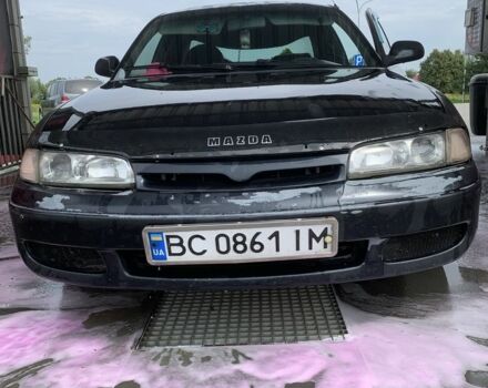 Черный Мазда 626, объемом двигателя 2 л и пробегом 345 тыс. км за 1100 $, фото 1 на Automoto.ua