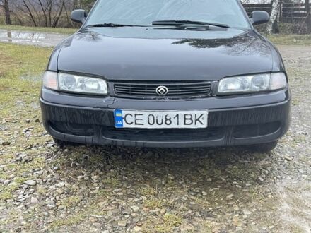 Черный Мазда 626, объемом двигателя 2 л и пробегом 250 тыс. км за 1150 $, фото 1 на Automoto.ua