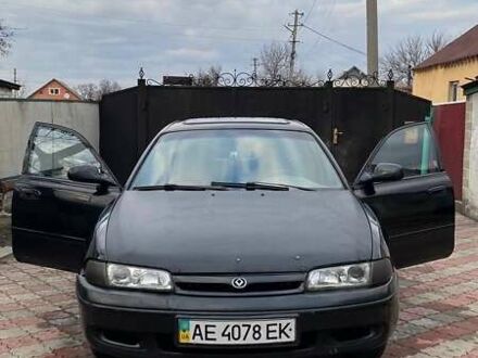 Черный Мазда 626, объемом двигателя 2 л и пробегом 155 тыс. км за 1500 $, фото 1 на Automoto.ua