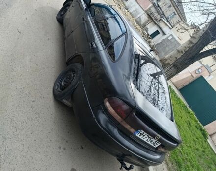 Черный Мазда 626, объемом двигателя 2 л и пробегом 270 тыс. км за 1000 $, фото 1 на Automoto.ua