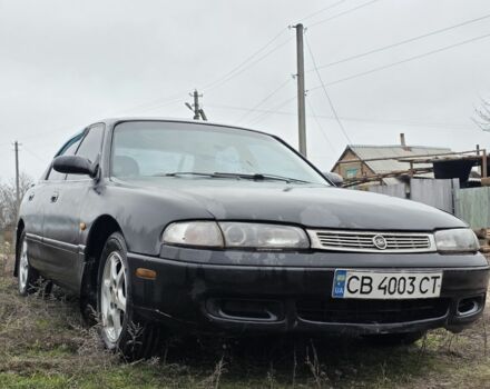 Черный Мазда 626, объемом двигателя 2 л и пробегом 250 тыс. км за 1500 $, фото 1 на Automoto.ua