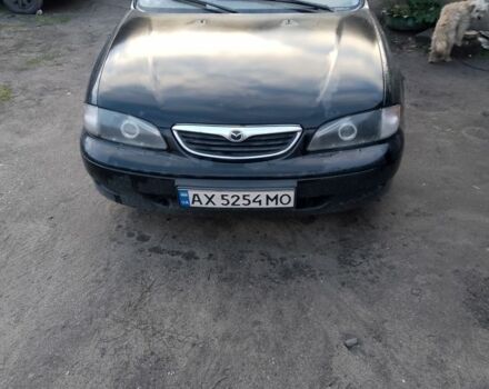 Черный Мазда 626, объемом двигателя 2 л и пробегом 100 тыс. км за 3000 $, фото 1 на Automoto.ua