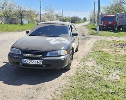 Черный Мазда 626, объемом двигателя 2 л и пробегом 253 тыс. км за 2600 $, фото 1 на Automoto.ua
