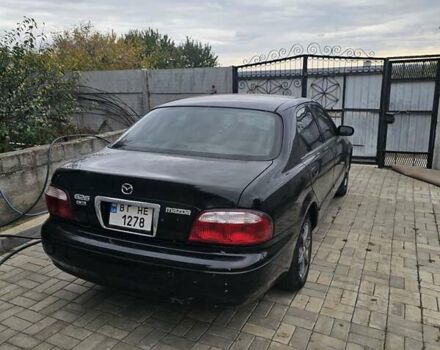 Чорний Мазда 626, об'ємом двигуна 2 л та пробігом 200 тис. км за 800 $, фото 1 на Automoto.ua