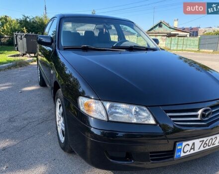 Черный Мазда 626, объемом двигателя 2 л и пробегом 370 тыс. км за 2500 $, фото 1 на Automoto.ua