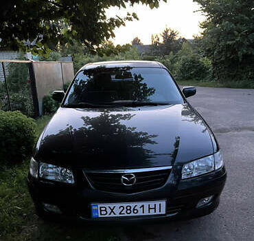 Черный Мазда 626, объемом двигателя 2 л и пробегом 210 тыс. км за 3000 $, фото 1 на Automoto.ua