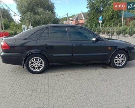 Чорний Мазда 626, об'ємом двигуна 1.8 л та пробігом 316 тис. км за 2700 $, фото 1 на Automoto.ua