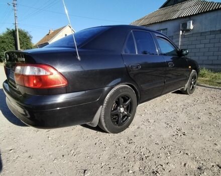 Черный Мазда 626, объемом двигателя 2 л и пробегом 324 тыс. км за 3100 $, фото 1 на Automoto.ua