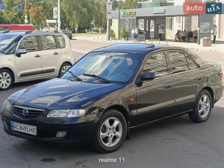 Черный Мазда 626, объемом двигателя 2 л и пробегом 408 тыс. км за 3400 $, фото 1 на Automoto.ua