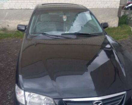 Черный Мазда 626, объемом двигателя 1.99 л и пробегом 400 тыс. км за 3500 $, фото 1 на Automoto.ua