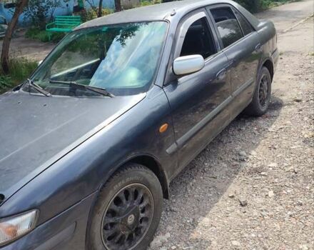 Фиолетовый Мазда 626, объемом двигателя 2 л и пробегом 320 тыс. км за 1200 $, фото 1 на Automoto.ua