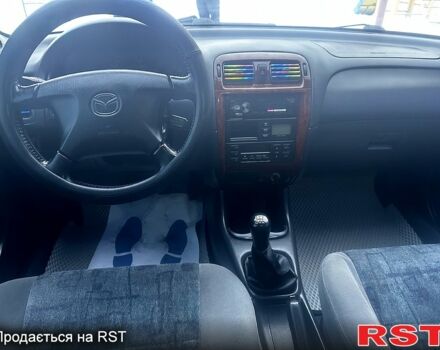 Фиолетовый Мазда 626, объемом двигателя 2 л и пробегом 350 тыс. км за 2800 $, фото 9 на Automoto.ua