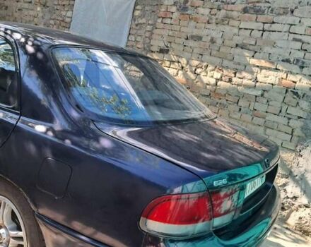 Фиолетовый Мазда 626, объемом двигателя 2 л и пробегом 300 тыс. км за 2100 $, фото 1 на Automoto.ua