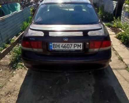 Коричневый Мазда 626, объемом двигателя 1.8 л и пробегом 200 тыс. км за 1161 $, фото 2 на Automoto.ua