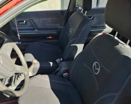 Красный Мазда 626, объемом двигателя 2 л и пробегом 209 тыс. км за 900 $, фото 6 на Automoto.ua