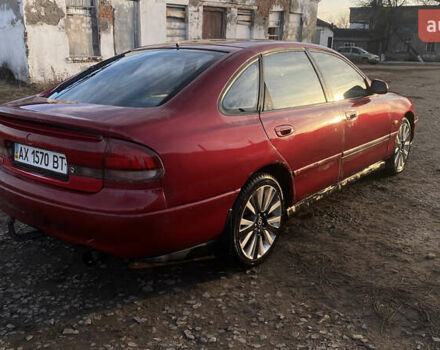 Красный Мазда 626, объемом двигателя 2.5 л и пробегом 345 тыс. км за 2000 $, фото 2 на Automoto.ua
