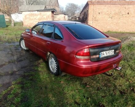 Красный Мазда 626, объемом двигателя 2 л и пробегом 350 тыс. км за 1999 $, фото 1 на Automoto.ua