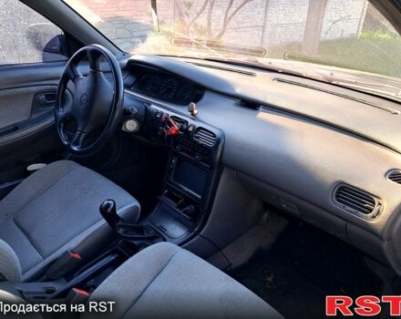 Червоний Мазда 626, об'ємом двигуна 1.8 л та пробігом 0 тис. км за 2100 $, фото 4 на Automoto.ua