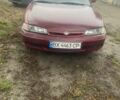 Красный Мазда 626, объемом двигателя 2 л и пробегом 300 тыс. км за 1350 $, фото 1 на Automoto.ua