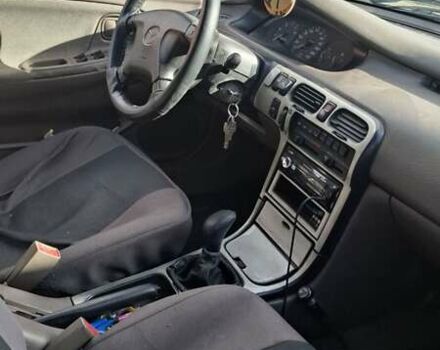 Красный Мазда 626, объемом двигателя 1.99 л и пробегом 380 тыс. км за 1500 $, фото 1 на Automoto.ua