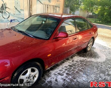 Красный Мазда 626, объемом двигателя 1.8 л и пробегом 300 тыс. км за 1250 $, фото 1 на Automoto.ua