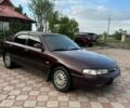 Красный Мазда 626, объемом двигателя 2 л и пробегом 300 тыс. км за 1850 $, фото 1 на Automoto.ua