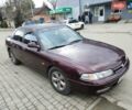 Красный Мазда 626, объемом двигателя 2 л и пробегом 300 тыс. км за 2200 $, фото 1 на Automoto.ua