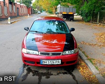 Красный Мазда 626, объемом двигателя 2 л и пробегом 320 тыс. км за 1500 $, фото 1 на Automoto.ua