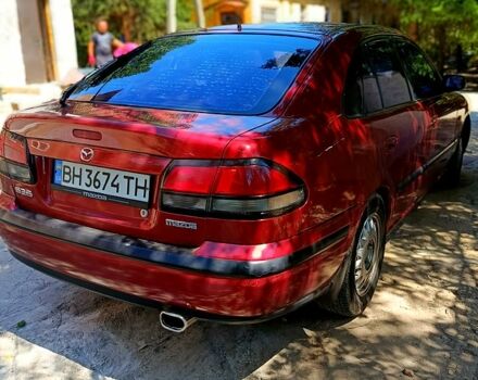 Красный Мазда 626, объемом двигателя 1.8 л и пробегом 270 тыс. км за 2800 $, фото 2 на Automoto.ua
