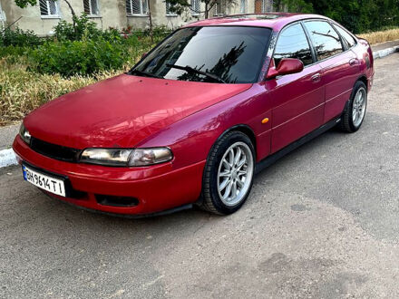 Красный Мазда 626, объемом двигателя 1.8 л и пробегом 303 тыс. км за 1600 $, фото 1 на Automoto.ua