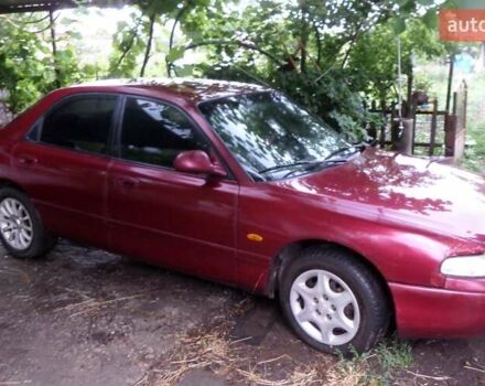 Красный Мазда 626, объемом двигателя 1.8 л и пробегом 250 тыс. км за 928 $, фото 1 на Automoto.ua