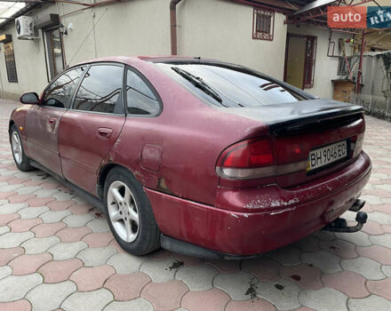 Красный Мазда 626, объемом двигателя 2 л и пробегом 300 тыс. км за 1300 $, фото 1 на Automoto.ua