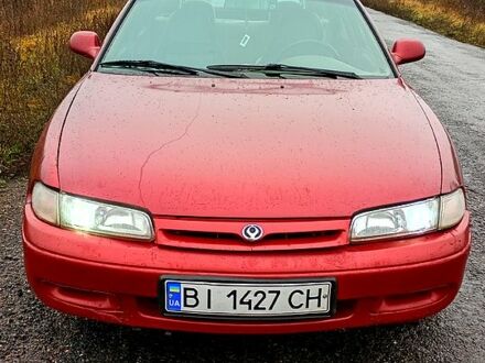 Красный Мазда 626, объемом двигателя 1.8 л и пробегом 33 тыс. км за 1500 $, фото 1 на Automoto.ua