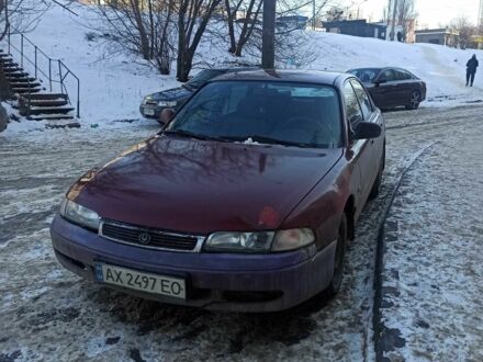 Красный Мазда 626, объемом двигателя 2 л и пробегом 290 тыс. км за 700 $, фото 1 на Automoto.ua