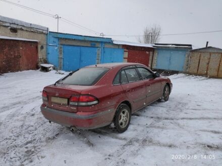 Красный Мазда 626, объемом двигателя 2 л и пробегом 202 тыс. км за 49999 $, фото 1 на Automoto.ua