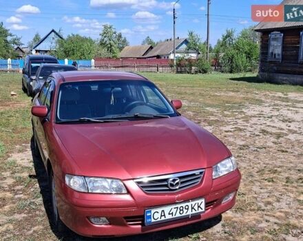 Красный Мазда 626, объемом двигателя 2 л и пробегом 300 тыс. км за 3250 $, фото 1 на Automoto.ua