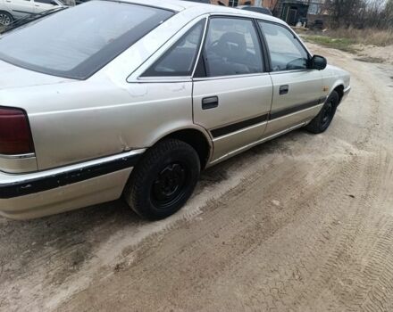 Серый Мазда 626, объемом двигателя 2 л и пробегом 280 тыс. км за 1300 $, фото 2 на Automoto.ua