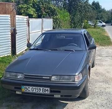 Серый Мазда 626, объемом двигателя 2 л и пробегом 300 тыс. км за 1900 $, фото 3 на Automoto.ua