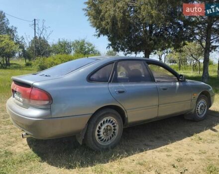 Сірий Мазда 626, об'ємом двигуна 1.84 л та пробігом 500 тис. км за 1999 $, фото 4 на Automoto.ua